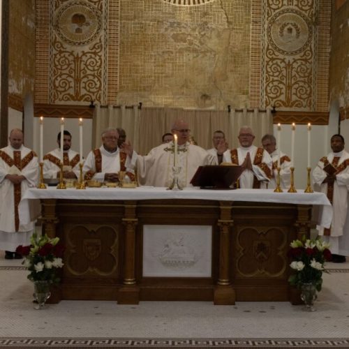 Bishop Rhoades and visiting clergy celebrating Mass at the new altar