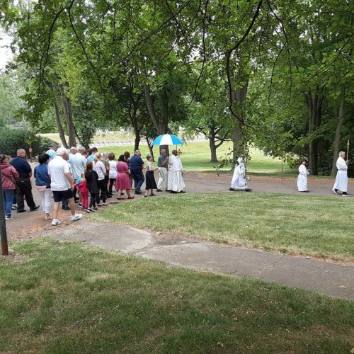 The Eucharistic procession reaches the Our Lady, Patroness of America Center