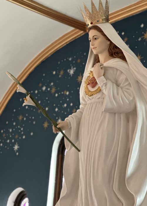 Statue of Our Lady offering the lily